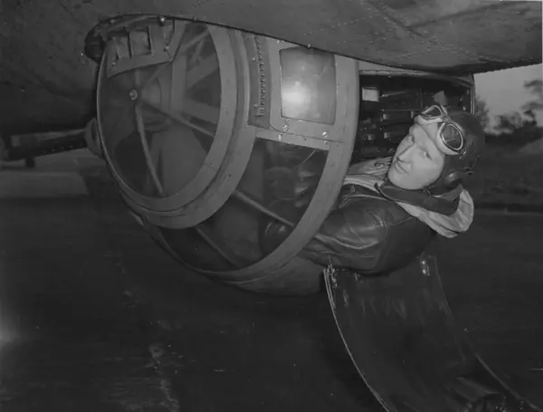 A ball turret gunner climbing into the turret of the B-17 “Hell’s Angels,” 303rd Bomb Group, England, June 6, 1943 (another gunner of Magee’s group, not Magee)