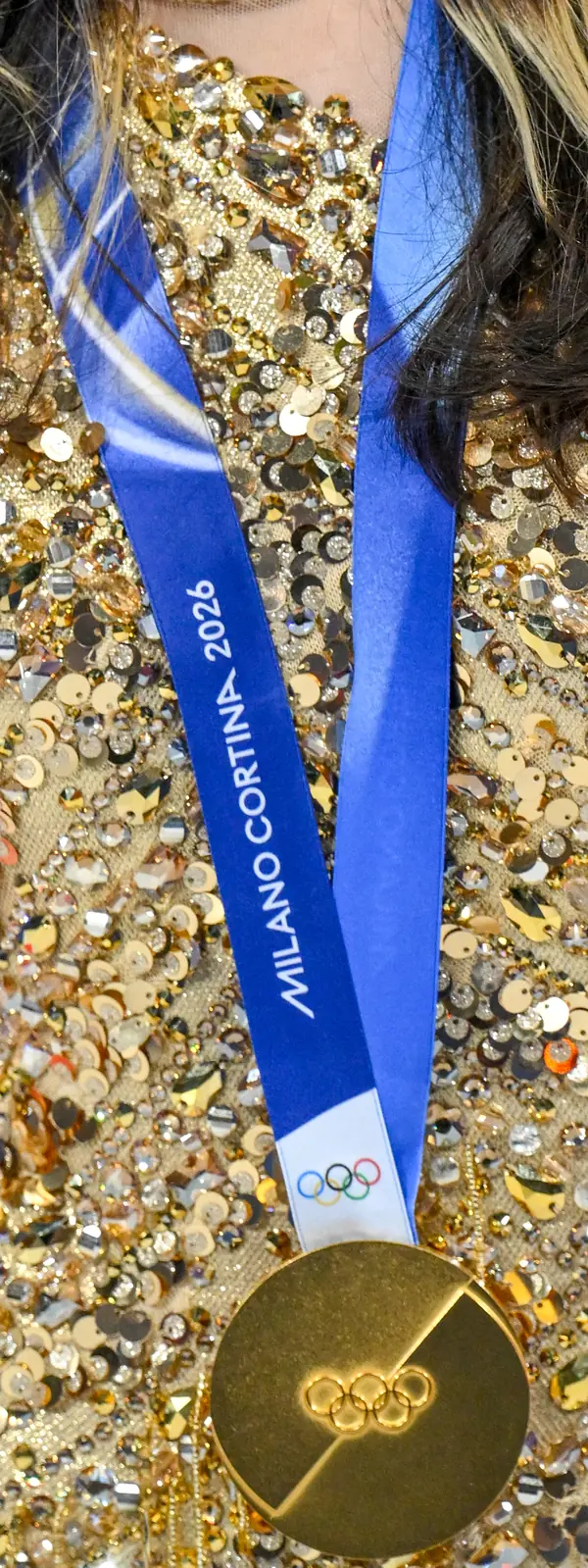 Her Milano Cortina 2026 Olympic gold medal, at the medal ceremony, February 19, 2026 (cropped)