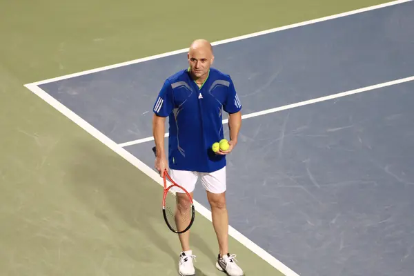Andre Agassi with two balls before serving, Rogers Cup legends exhibition, Toronto, August 13, 2011