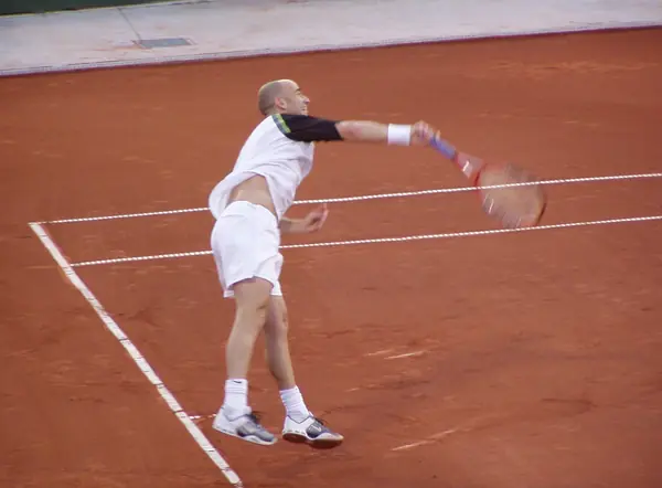 Andre Agassi serving at the US Men’s Clay Court Championships, Houston, April 19, 2005 (not against Becker)