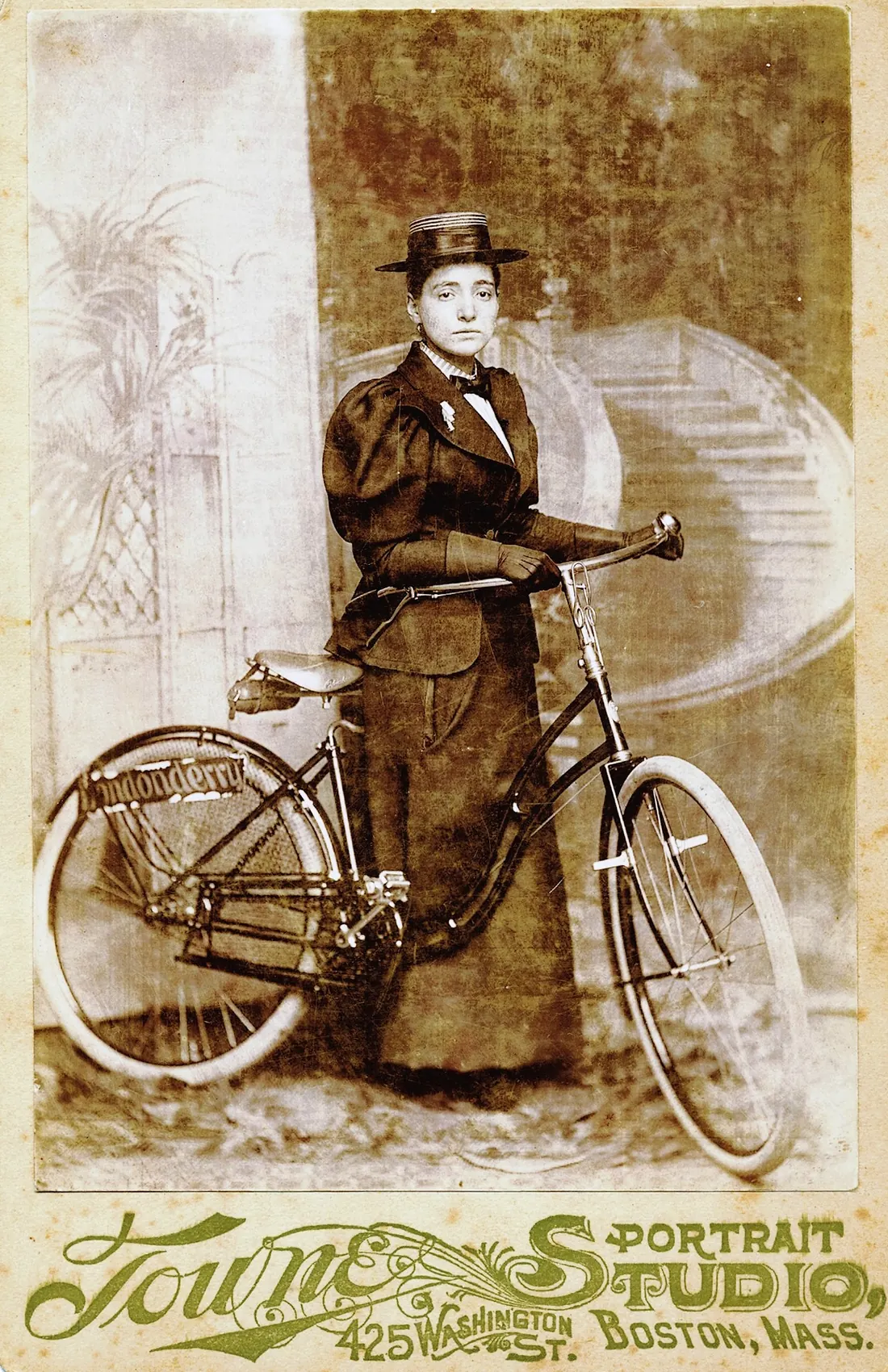 Annie Kopchovsky (“Annie Londonderry”) with her Columbia bicycle and Londonderry placard, Boston