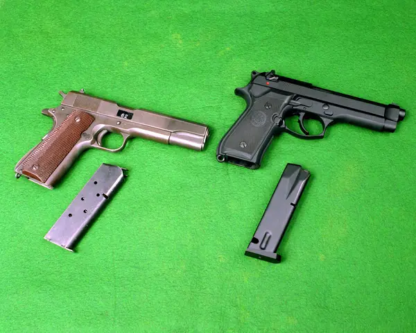 An M1911A1 .45 pistol, with an M9, 1985 (not Murphy’s own)