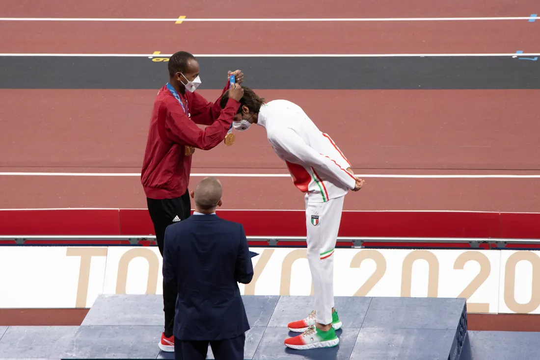 Mutaz Barshim presents Gianmarco Tamberi with his gold medal, Tokyo Olympic Stadium, August 2, 2021, the day after the final