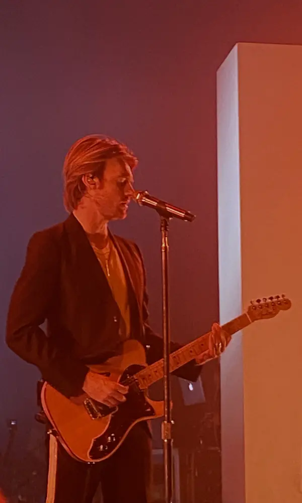 Finneas playing an electric guitar at the Beanfield Theatre, Montreal, November 20, 2021 (not his old band)