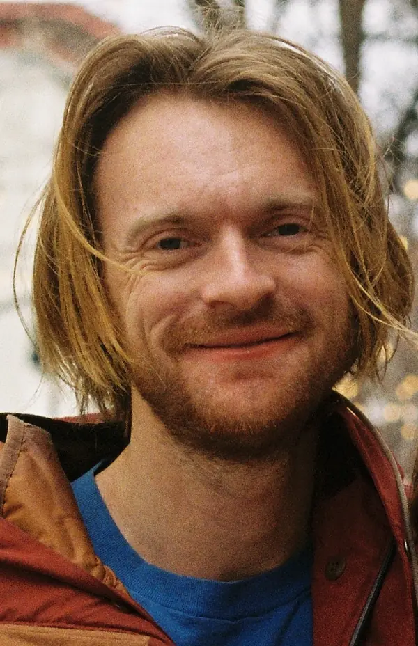 Finneas smiling on a street in Raleigh, North Carolina, February 16, 2025