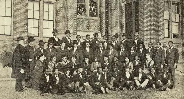 Washington’s graduating class at Hampton Institute, 1875, with Washington second from left in the front row