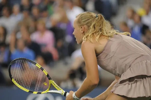 Caroline Wozniacki bent over at the baseline at the US Open, September 7, 2009 (not Doha)