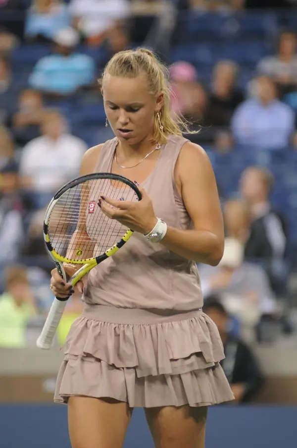 Caroline Wozniacki, head down over her strings, at the US Open, September 7, 2009 (not Doha)