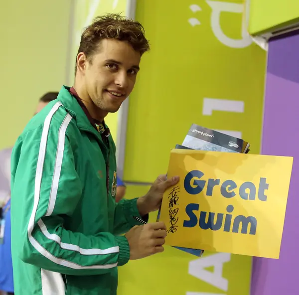 Chad le Clos with a “Great Swim” sign at the FINA World Cup, Doha, October 21, 2013