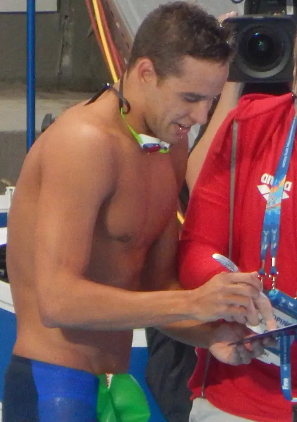 Chad le Clos signing after his 100-meter butterfly win, World Championships, Kazan, Russia, August 8, 2015