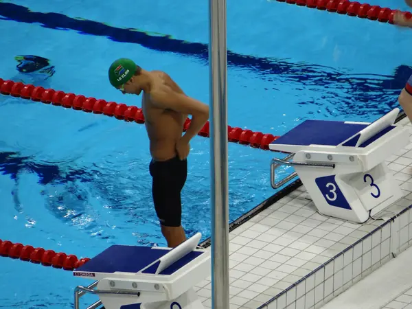 Chad le Clos (green cap) at the blocks before his 200-meter individual medley heat, London 2012 Aquatics Centre, August 1, 2012 (not the butterfly final)