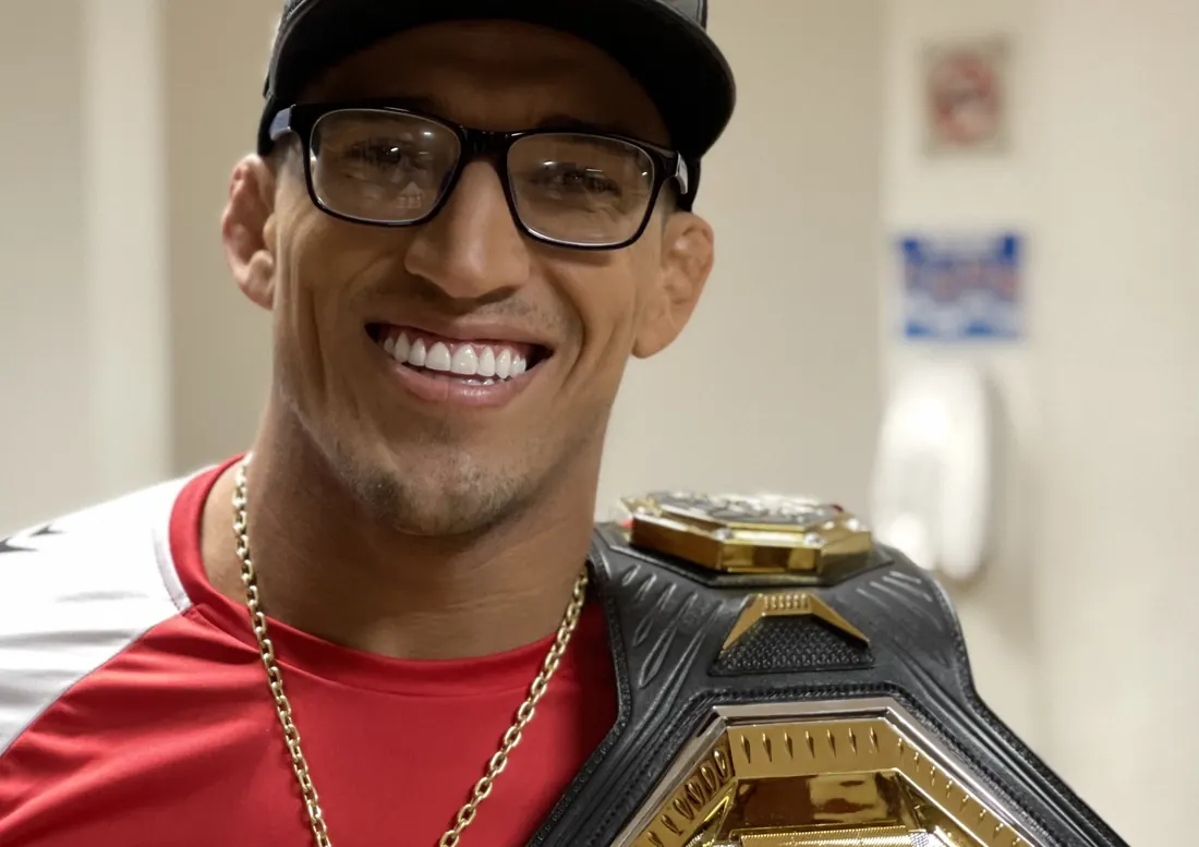 Charles Oliveira with his UFC lightweight belt, Brasília, June 25, 2021, six weeks after UFC 262 (not the title fight) (cropped)