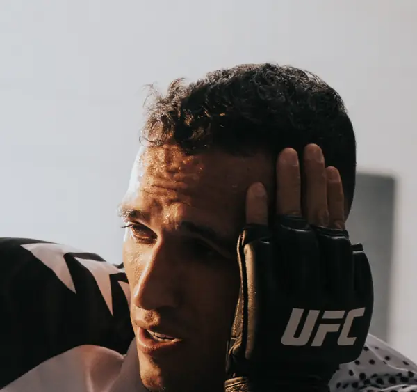 Charles Oliveira in training, a glove to his head, October 5, 2021 (not the Chandler fight) (cropped)