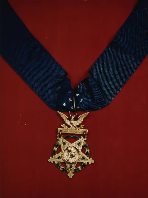 A US Army Medal of Honor with neck band, 1941–45 (not his medal, which was presented in 2000)