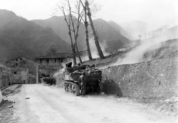 As the 442nd pushes on Mount Belvedere, tanks of the 756th Light Tank Battalion fire from Seravezza, Italy, April 8, 1945 (not the April 21 attack)