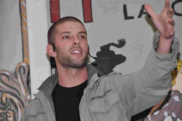 Darcy Oake reaching up at the “All That Glitters” charity gala, May 7, 2010 (not the 2019 show)