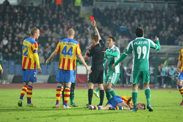 A referee shows a red card, Ludogorets v Valencia, Europa League, March 13, 2014 (not Beckham’s red card)