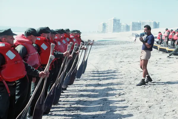 SEAL candidates of BUD/S Class 183 get instructions before a timed boat exercise, Coronado, 1997 (not Goggins)