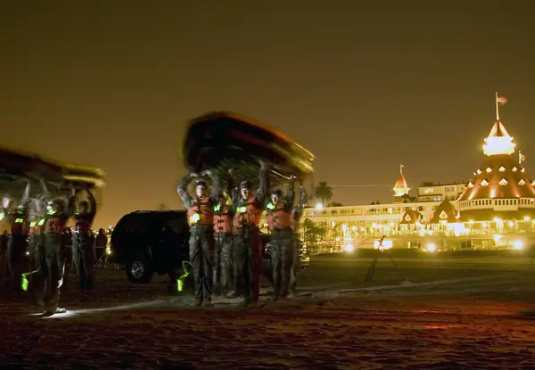 BUD/S Class 267 carrying boats on the beach at night in Hell Week, the Hotel del Coronado behind, September 10, 2007 (not Goggins)