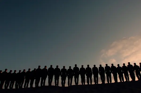 A line of Hell Week candidates silhouetted at Coronado, August 2004 (not Goggins)