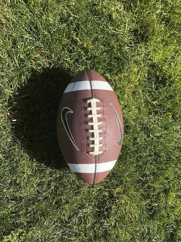 An American football on grass, February 25, 2018 (not his)