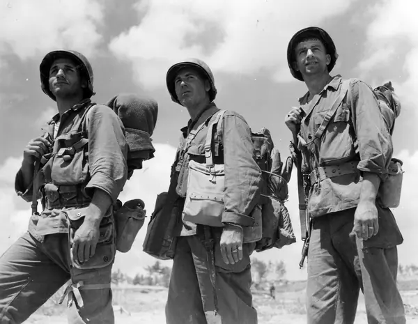 SC 374740 - Three Rochester men, each a veteran of all campaigns in which the 77th Div. has participated in, move up to the front. 14 May, 1945. (49345799272)