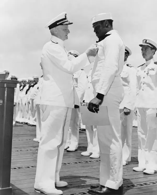 Admiral Chester W. Nimitz pins the Navy Cross on Doris Miller, Pearl Harbor, May 27, 1942