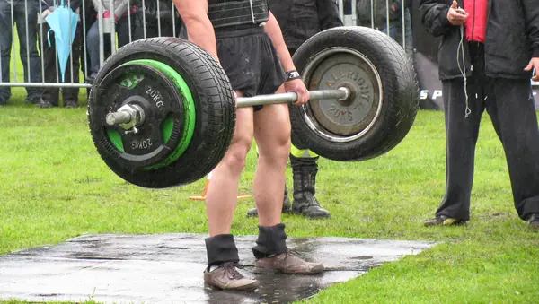 A strongman deadlift at a contest in Poland, in the rain (cropped; a stand-in, not Eddie Hall)