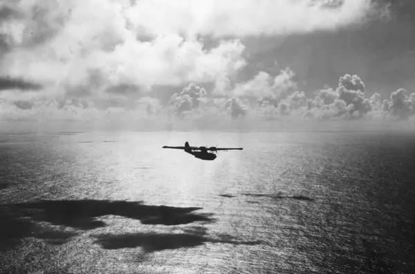 A US Navy PBY Catalina on patrol, World War II (a stand-in for the search planes)