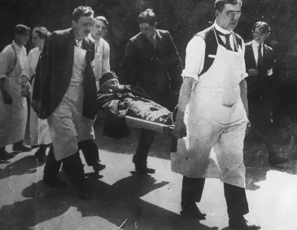 A wounded Belgian soldier carried into a Brussels hospital, August 15, 1914 (not Cavell’s hospital)