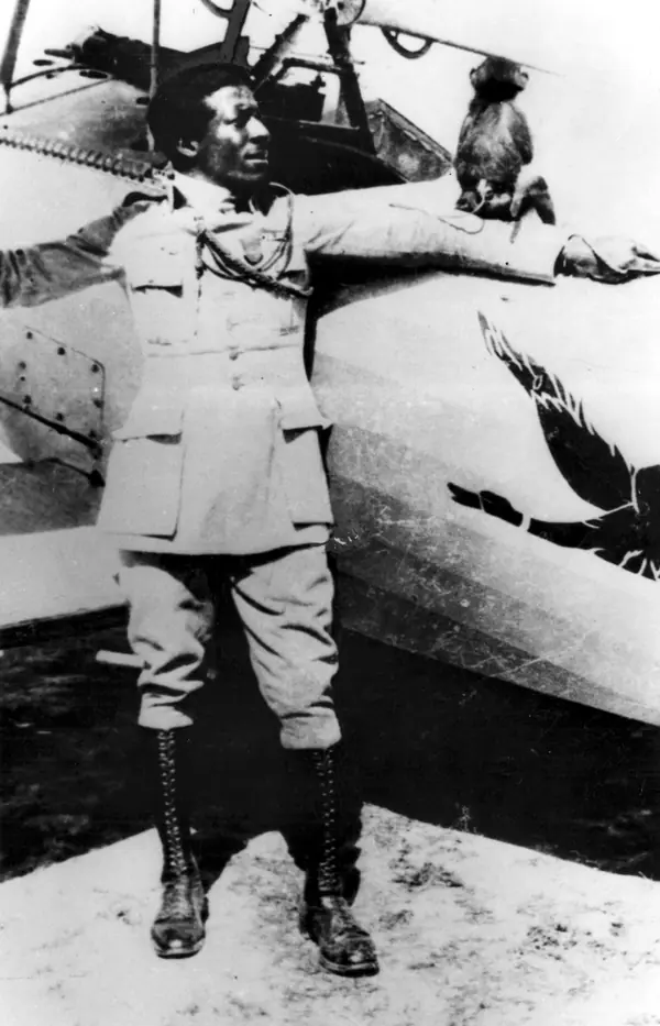 Eugene Bullard with his monkey Jimmy beside a Nieuport 24 fighter of Escadrille SPA 93, August–September 1917