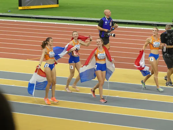 The Dutch women’s 4×400-meter team, Femke Bol among them, with their flags after the final, Budapest, August 27, 2023