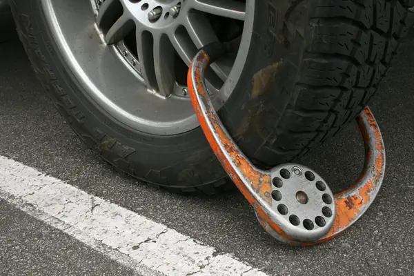 A wheel boot on the same car, Durham, North Carolina, February 26, 2009 (not the mother’s car)