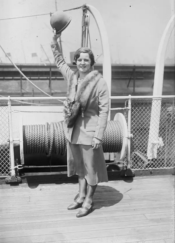 Gertrude Ederle waving on a ship’s deck, 1925