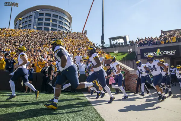 Michigan, the visiting team, runs out under the hospital tower, Kinnick Stadium, October 1, 2022