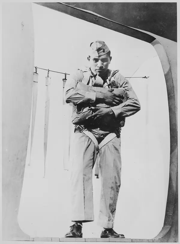 Pfc. Ira H. Hayes, a Pima, at age 19, ready to jump, Marine Corps Paratroop School, 1943