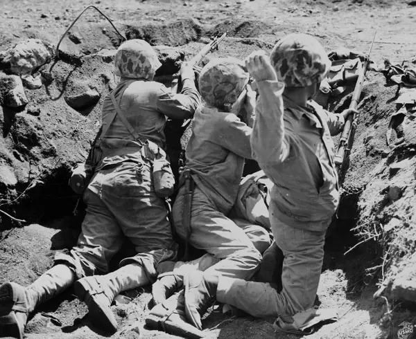 Three Marines of the 4th MARDIV in a foxhole on Iwo Jima. (49484107741)