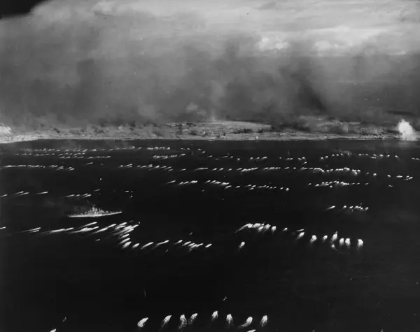 Initial waves of amphibious tractors head for the landing beaches on Iwo Jima, 19 February 1945 (80-G-310951)