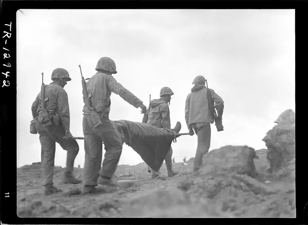 Transportation of wounded on Iwo Jima. A wounded Marine being evacuated from front lines for medical treatment. - NARA - 520734