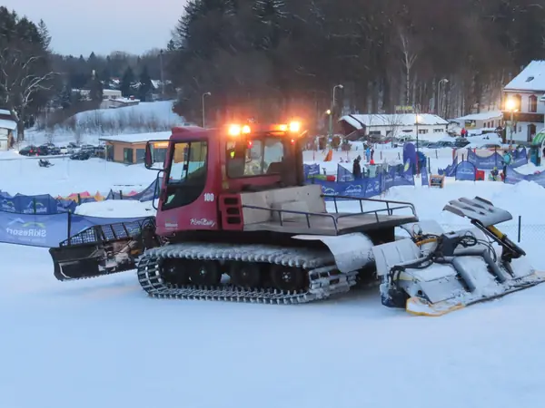 A PistenBully 100 snow groomer at dusk, Janské Lázně, Czech Republic, February 12, 2022 (not his)