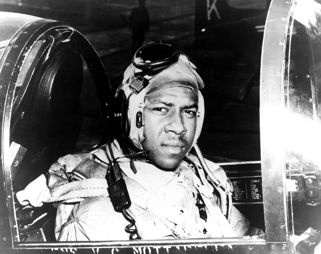 Ensign Jesse L. Brown in the cockpit of a VF-32 F4U-4 Corsair, 1950
