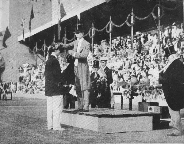 King Gustaf V crowning an athlete (not identified) at the 1912 Olympic prize-giving