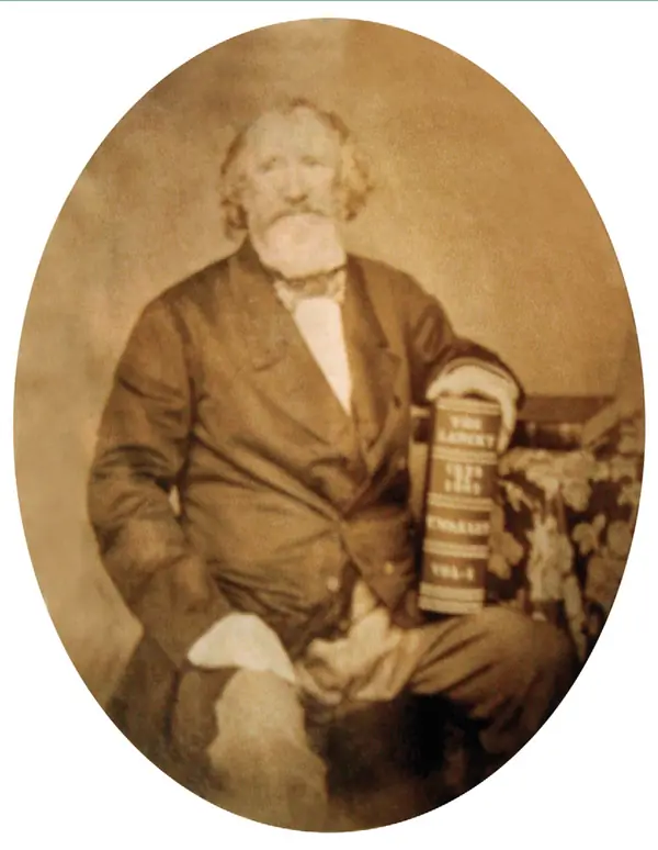 Thomas Wakley, founding editor of The Lancet, holding a Lancet volume, about 1862