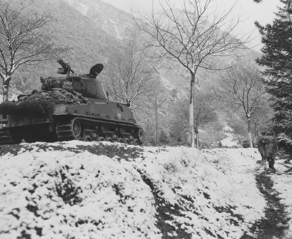 103rd Infantry Division infantrymen in a ditch move up toward machine-gun fire, May 1, 1945 (not Medicine Crow)