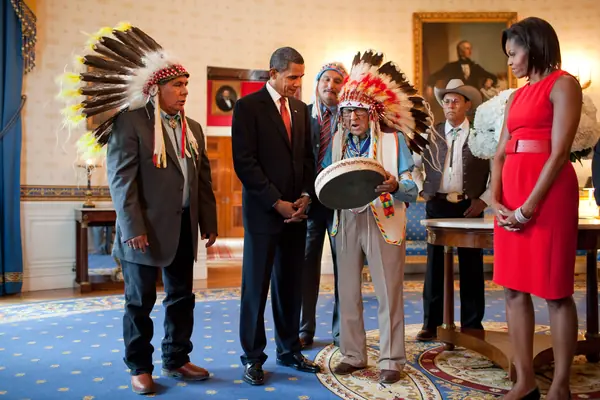 Joseph Medicine Crow shows a drum to President Barack Obama in the Blue Room of the White House, August 12, 2009