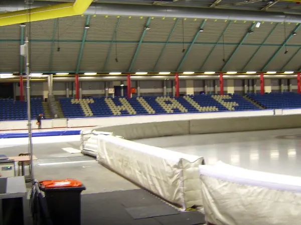 A turn with crash pads and the THIALF seat letters at the old Thialf, Heerenveen, March 26, 2012 (not the 2025 trials)