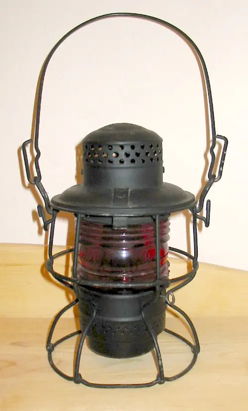 A Chicago & North Western brakeman’s lantern (a railroad lantern like her father’s, not hers)