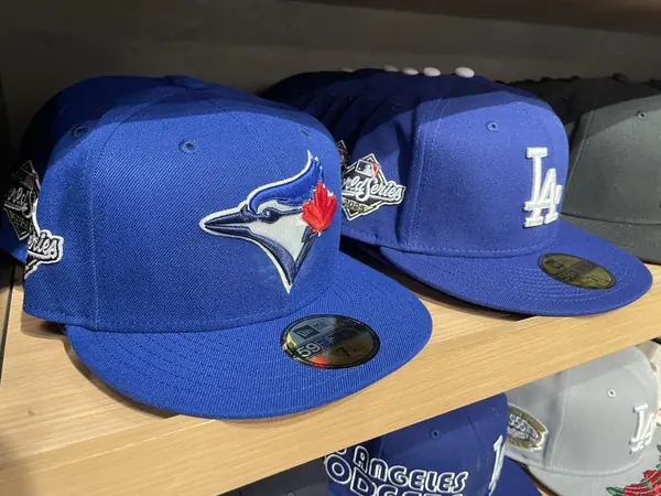 Blue Jays and Dodgers 2025 World Series caps in a shop, Shibuya, Tokyo, November 10, 2025