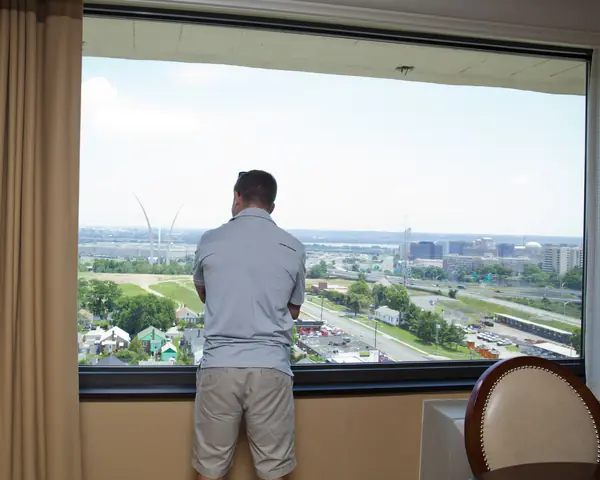 Kyle Carpenter looks out of a hotel window in Arlington, June 16, 2014, three days before the ceremony
