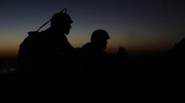 Two Marines of Combat Logistics Battalion 3 on rooftop security in Marjah, December 2010 (not Kyle Carpenter and Nick Eufrazio)